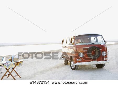 Picture - Van parked on beach. Fotosearch