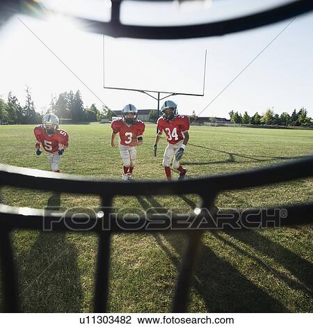 View of football players and field from inside helmet View Large Photo Image Stock Image - View of football players and field from inside helmet. Fotosearch
