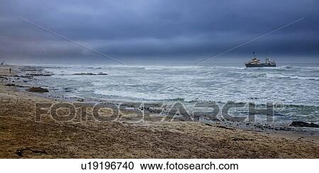 Stock Image - View of ocean and ship in distance, Namibia, Africa. Fotosearch