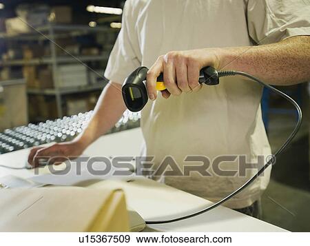 Warehouse worker scanning package View Large Photo Image Stock Photo - Warehouse worker scanning package. Fotosearch