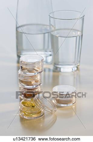 Water and vitamin container View Large Photo Image Stock Photograph - Water and vitamin container. Fotosearch