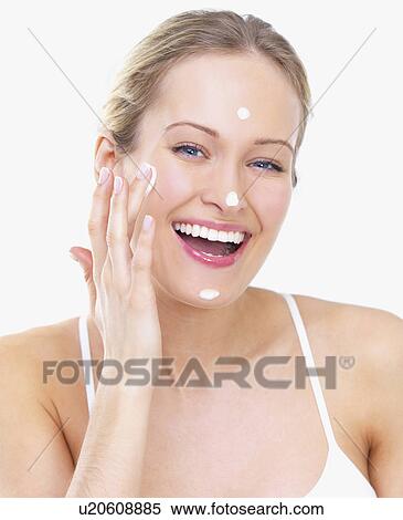 Woman applying face cream View Large Photo Image Stock Photography - Woman applying face cream. Fotosearch