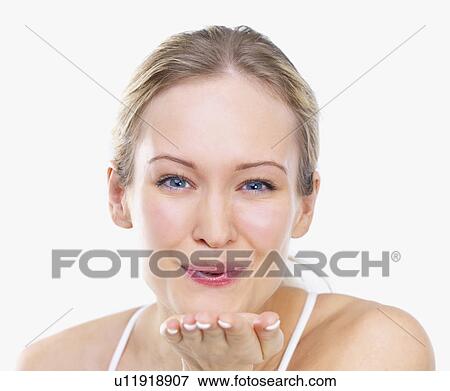 Stock Photo - Woman blowing kiss. Fotosearch