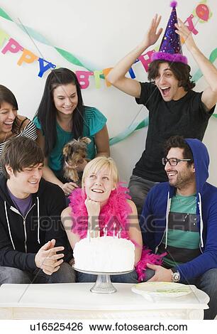 Woman celebrating birthday with friends View Large Photo Image Stock Photograph - Woman celebrating birthday with friends. Fotosearch