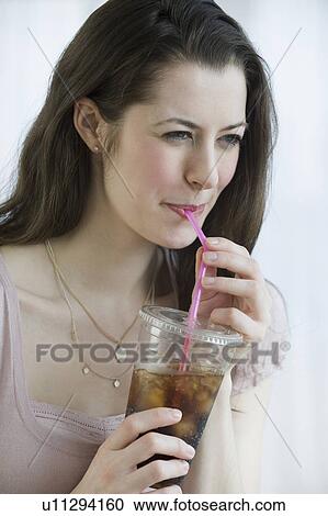 Woman drinking soda View Large Photo Image Stock Image - Woman drinking soda. Fotosearch