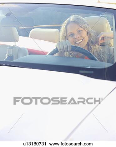 Woman driving car View Large Photo Image Stock Image - Woman driving car. Fotosearch