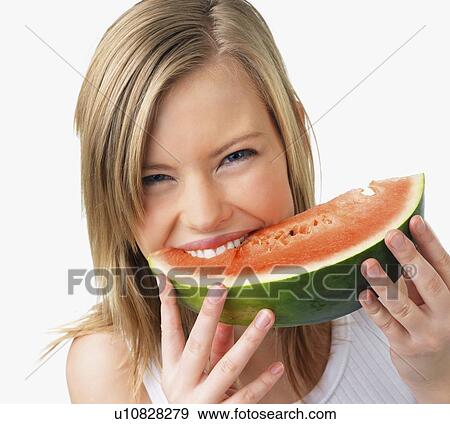 Woman eating watermelon View Large Photo Image Stock Photo - Woman eating watermelon. Fotosearch