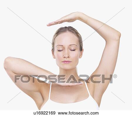 Woman framing face with hands View Large Photo Image Stock Photo - Woman framing face with hands. Fotosearch
