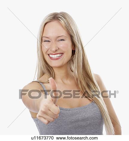 Stock Image - Woman giving thumbs up. Fotosearch