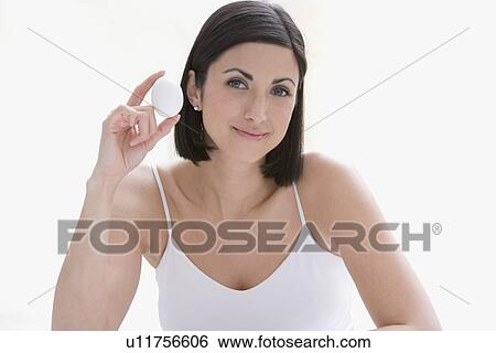Stock Photograph - Woman holding egg. Fotosearch