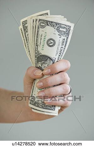 Woman holding handful of money View Large Photo Image Stock Image - Woman holding handful of money. Fotosearch
