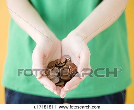 Woman holding handful of pennies View Large Photo Image Stock Image - Woman holding handful of pennies. Fotosearch
