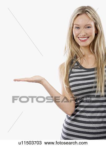 Stock Image - Woman holding out hand palm up. Fotosearch