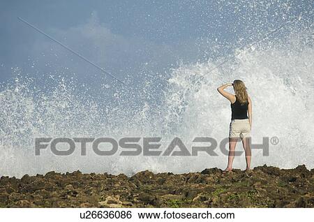 Woman looking out over ocean, Oahu, Hawaii, United States View Large Photo Image Stock Photograph - Woman looking out over ocean, Oahu, Hawaii, United States. Fotosearch