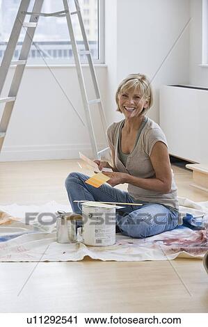 Woman painting room View Large Photo Image Stock Image - Woman painting room. Fotosearch