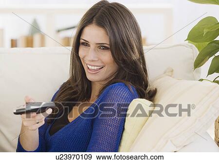 Woman pointing remote control View Large Photo Image Stock Photo - Woman pointing remote control. Fotosearch
