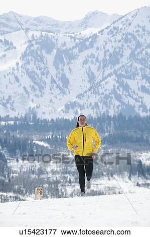 Woman running in snow View Large Photo Image Stock Photo - Woman running in snow. Fotosearch