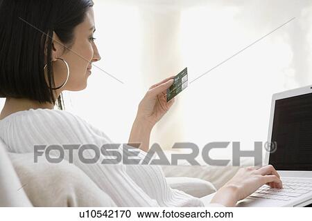 Woman shopping online View Large Photo Image Stock Image - Woman shopping online. Fotosearch