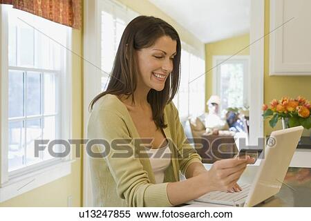 Woman shopping online View Large Photo Image Stock Photography - Woman shopping online. Fotosearch