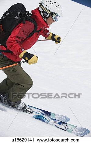 Woman skiing downhill View Large Photo Image Stock Image - Woman skiing downhill. Fotosearch