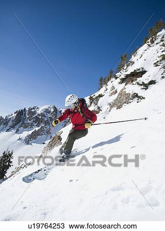 Stock Image - Woman skiing downhill. Fotosearch