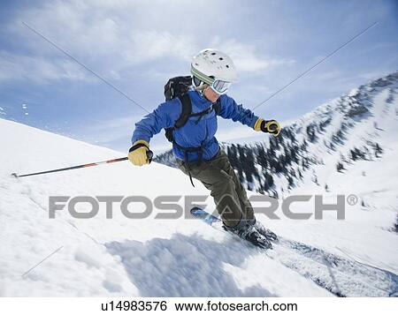 Stock Photograph - Woman skiing downhill. Fotosearch