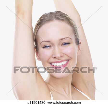 Woman stretching arms over head View Large Photo Image Stock Image - Woman stretching arms over head. Fotosearch