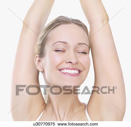 Woman stretching with eyes closed View Large Photo Image Stock Photography - Woman stretching with eyes closed. Fotosearch