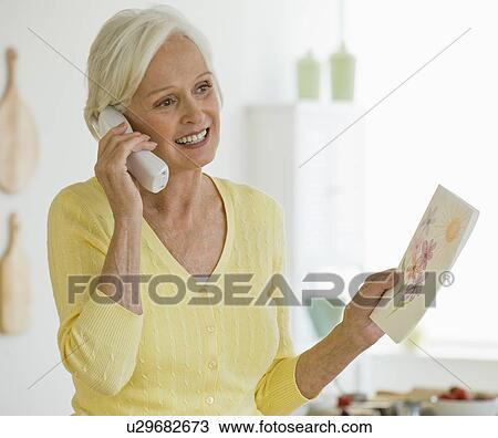 Woman talking on telephone View Large Photo Image Stock Image - Woman talking on telephone. Fotosearch