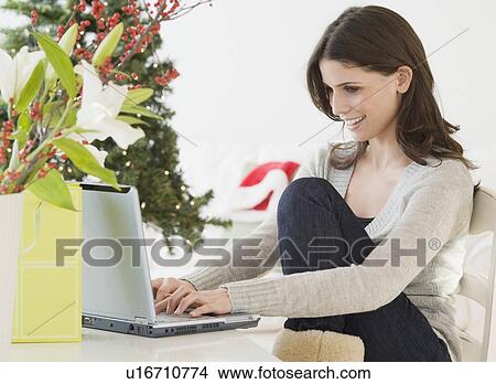 Woman typing on laptop View Large Photo Image Picture - Woman typing on laptop. Fotosearch