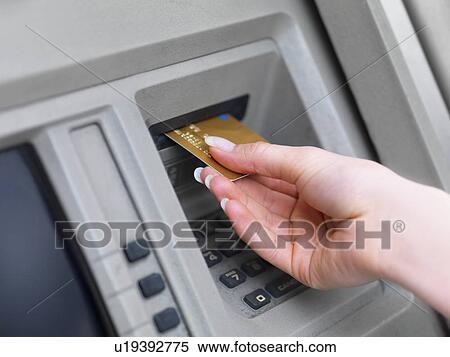 Woman using cash machine View Large Photo Image Stock Photography - Woman using cash machine. Fotosearch