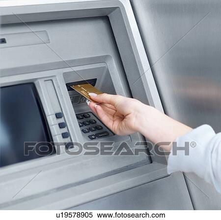 Woman using cash machine View Large Photo Image Stock Photography - Woman using cash machine. Fotosearch