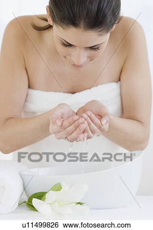 Woman washing face View Large Photo Image Stock Photograph - Woman washing face. Fotosearch