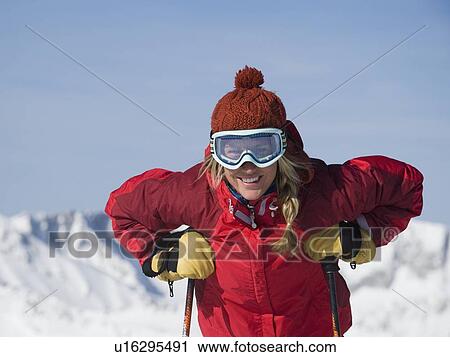 Stock Image - Woman wearing ski gear. Fotosearch