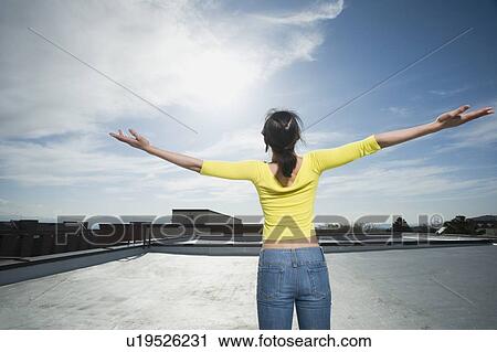 Stock Image - Woman with arm outstretched. Fotosearch