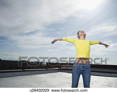 Stock Photo - Woman with arm outstretched. Fotosearch