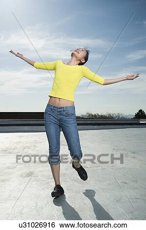 Woman with arm outstretched View Large Photo Image Stock Photograph - Woman with arm outstretched. Fotosearch
