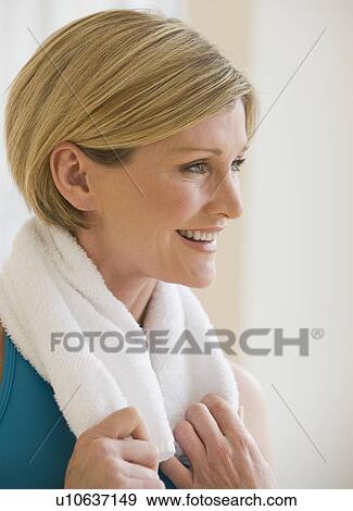 Woman with towel around neck View Large Photo Image Stock Photo - Woman with towel around neck. Fotosearch