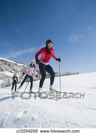 Stock Photo - Women cross country skiing. Fotosearch