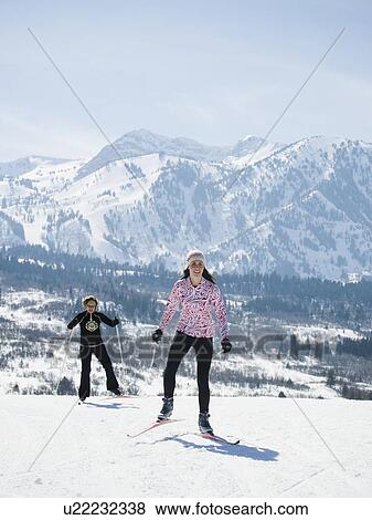 Women cross country skiing View Large Photo Image Stock Photo - Women cross country skiing. Fotosearch