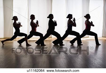 Women exercising in yoga class View Large Photo Image Picture - Women exercising in yoga class. Fotosearch