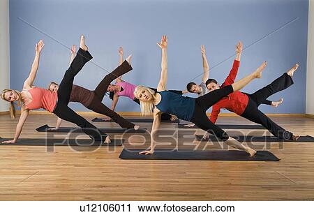 Women exercising in yoga class View Large Photo Image Stock Image - Women exercising in yoga class. Fotosearch