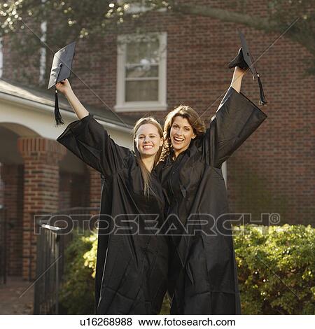 Stock Photo - Women graduates cheering. Fotosearch
