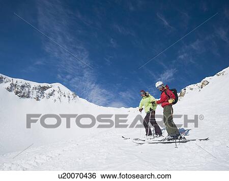 Women standing on skis View Large Photo Image Stock Photograph - Women standing on skis. Fotosearch