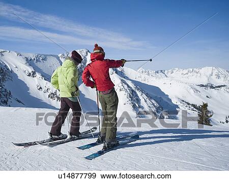 Stock Photo - Women standing on skis, Wasatch Mountains, Utah, United States. Fotosearch