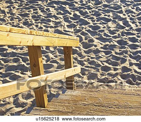 Stock Photo - Wooden steps down to sand. Fotosearch