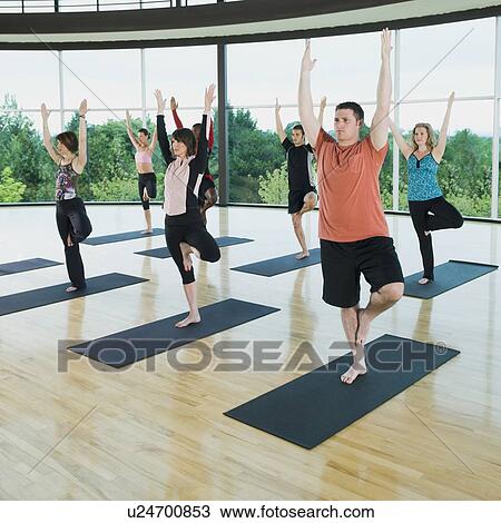 Yoga class in mountain pose View Large Photo Image Stock Image - Yoga class in mountain pose. Fotosearch