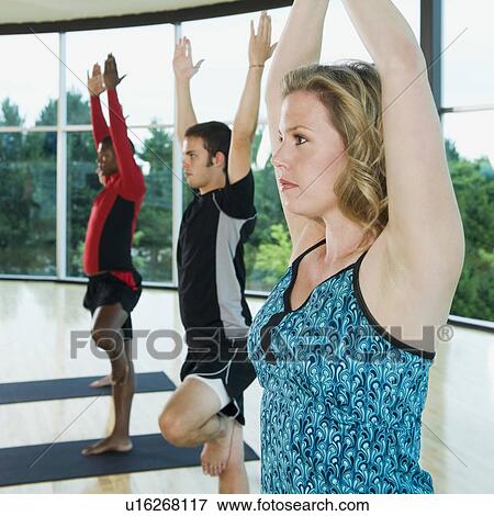 Yoga class in mountain pose View Large Photo Image Stock Photo - Yoga class in mountain pose. Fotosearch