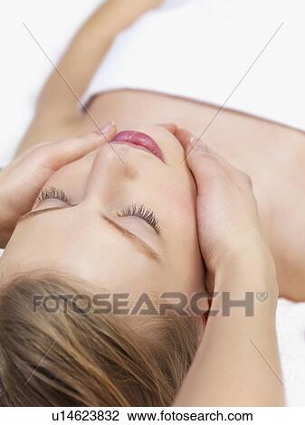 Young woman getting massage View Large Photo Image Stock Image - Young woman getting massage. Fotosearch