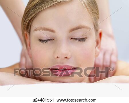 Young woman getting massage View Large Photo Image Stock Image - Young woman getting massage. Fotosearch